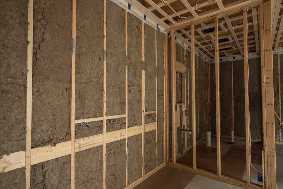 Mineral wool batts in the stud bays.
