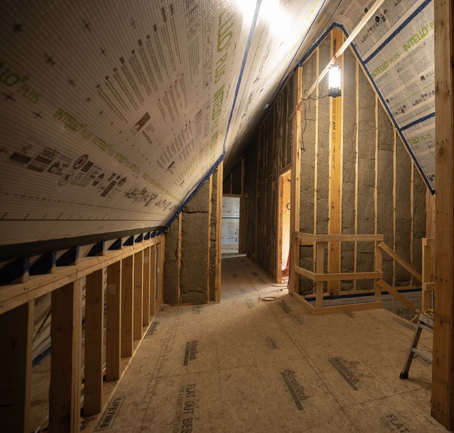 Membrane overhead, mineral wool batts in the wall.