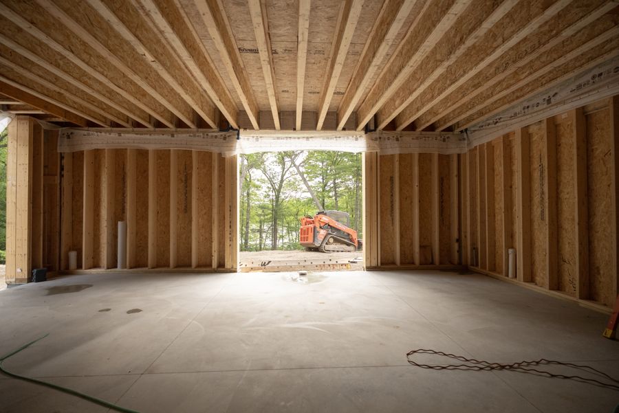 Floor framing over the first floor, looking through the breezeway.