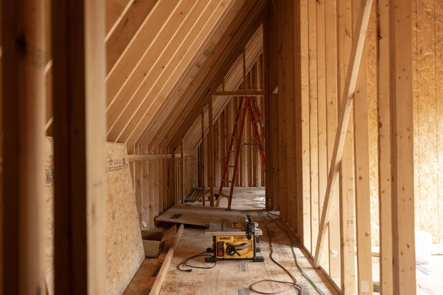 Rafters meeting the low wall on the second floor.