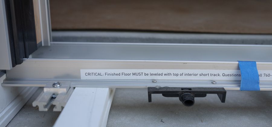 The track of a lift-slide unit, set into the slab.