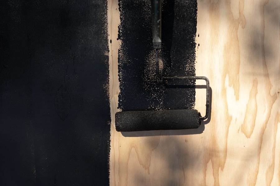 Pine tar rolled onto plywood.
