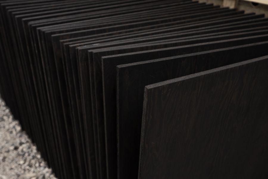 Coated panels stacked on edge.