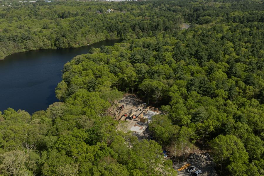 The house site and Glen Echo Pond from the air, during framing.