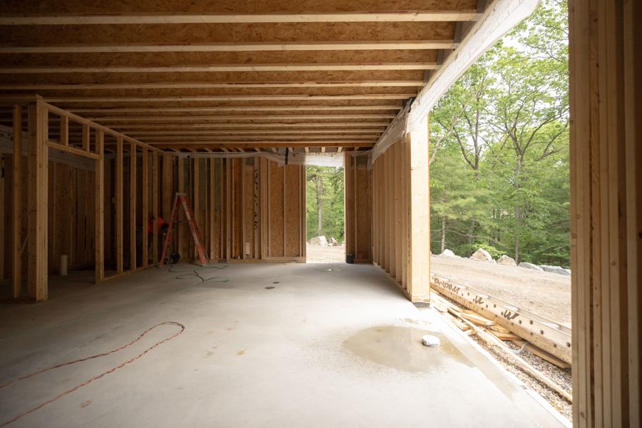 The first floor framed, open to the woods.