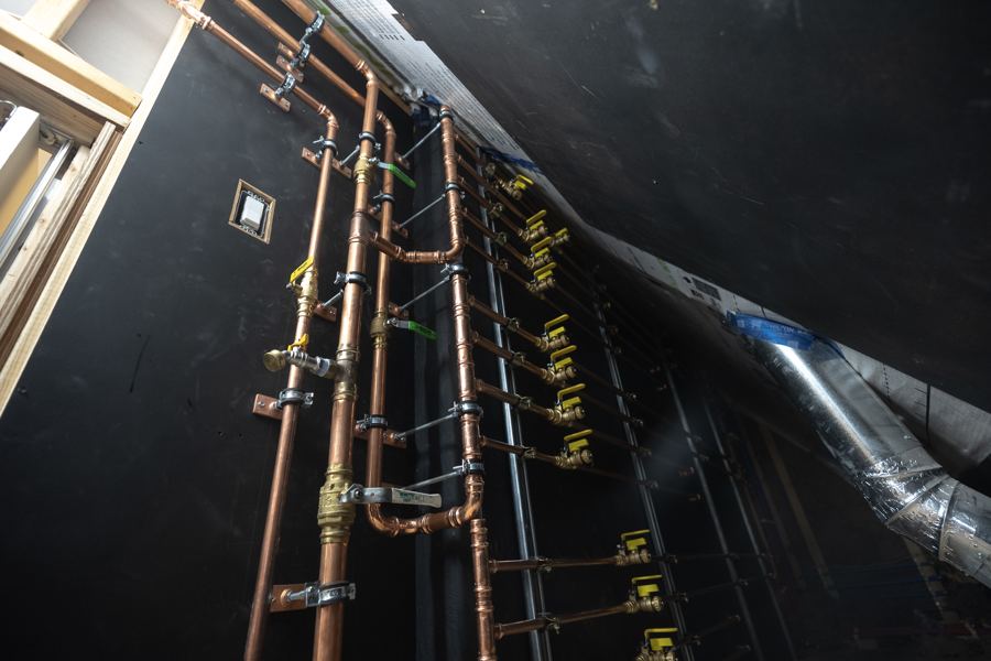 Copper supply lines against the black membrane.