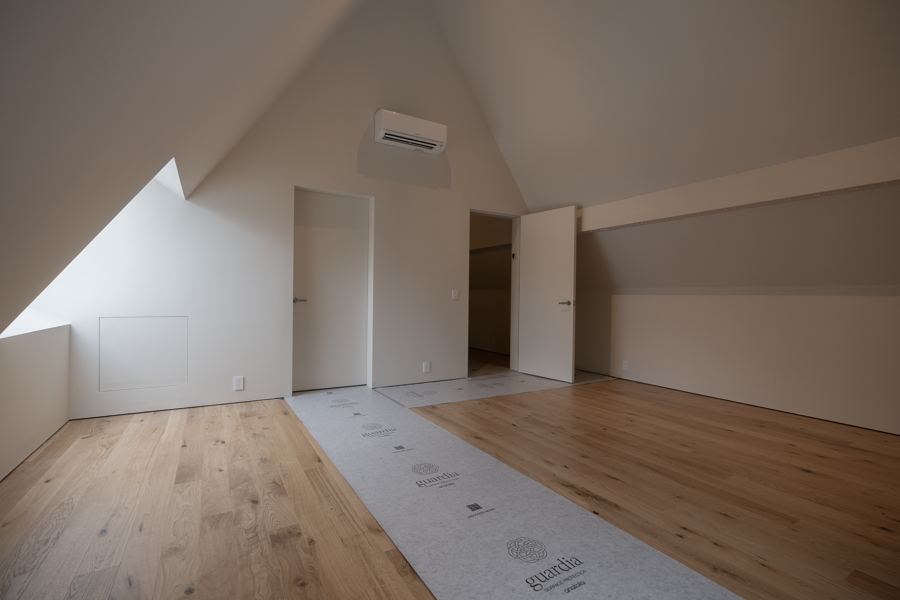The second floor, finished, with floor protection still down.