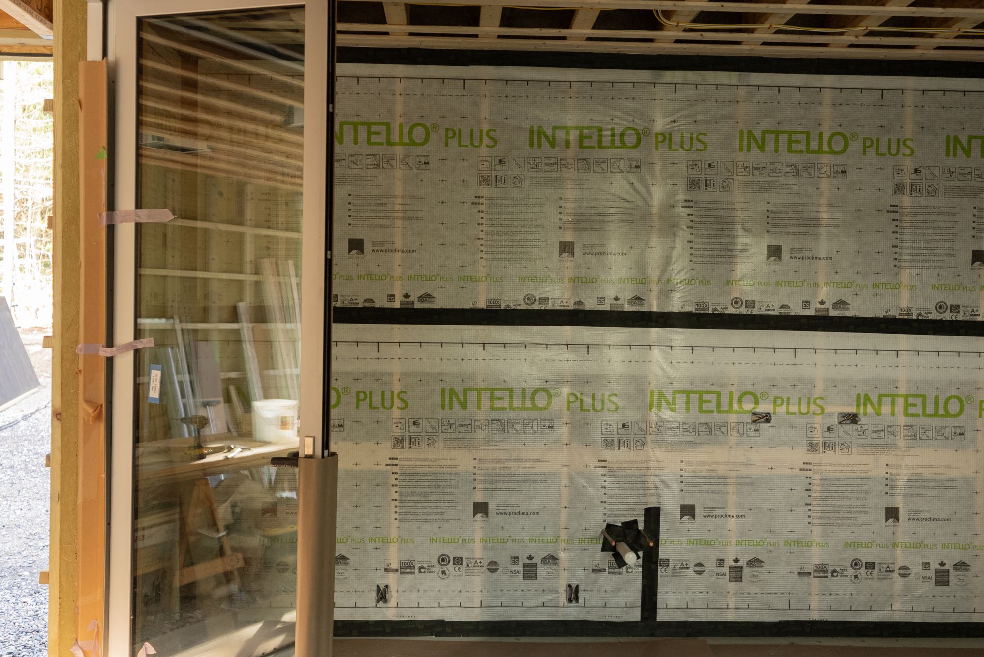 The interior air-control membrane across the wall framing